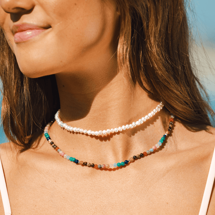 Master Healer + Self Love Necklace Stack, worn at the beach