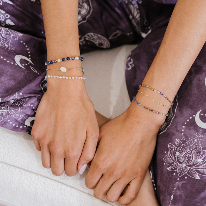 Master Manifestor 2mm Layered Healing Bracelet, worn seated