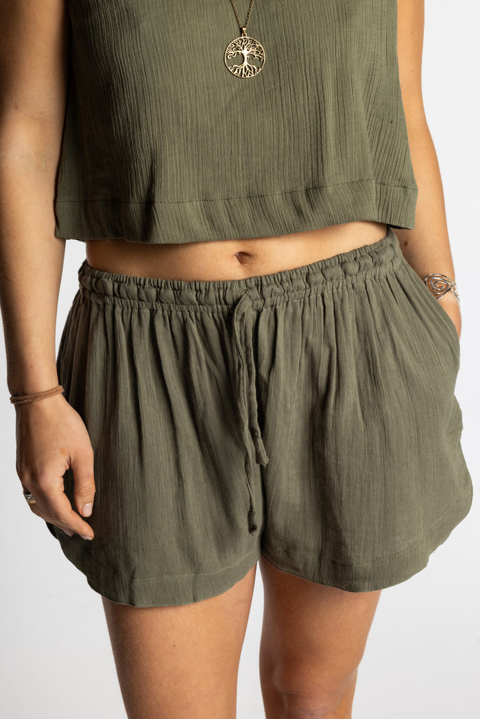 Sophie wearing Mel Milaana Cotton Drawstring Shorts in olive with matching olive Sahana Sleeveless Cotton Top, one size