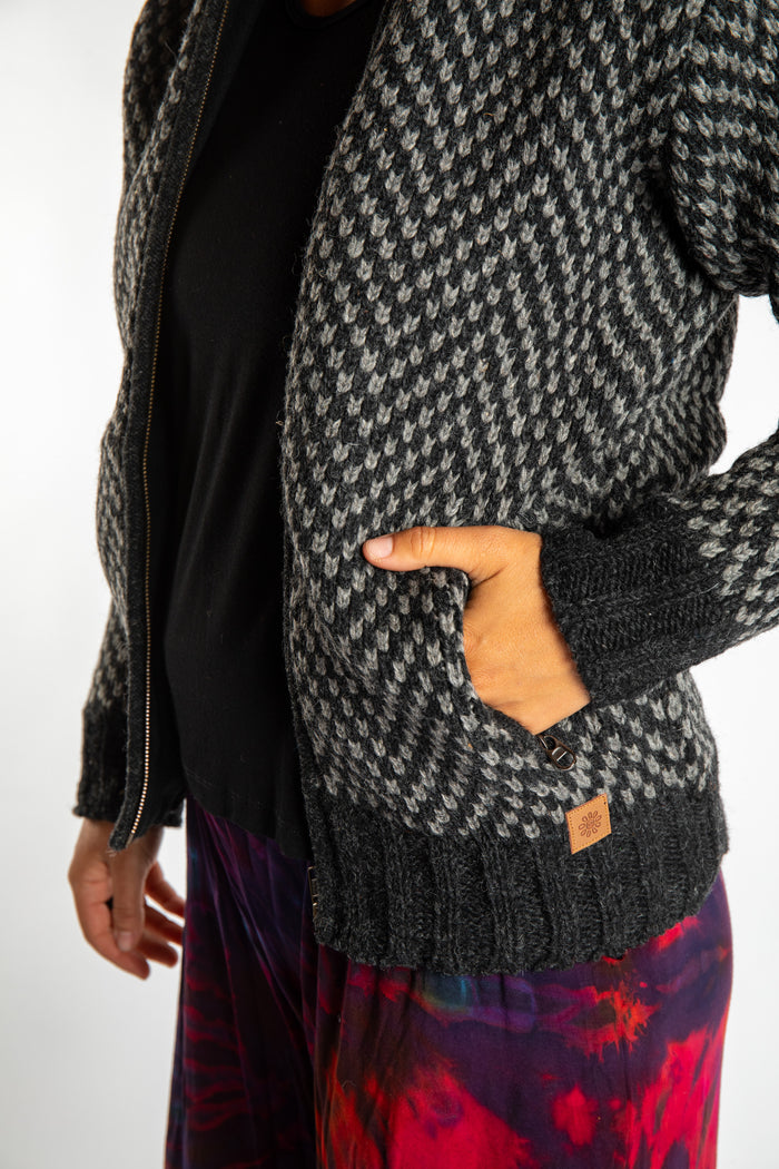 detail of pocket on charcoal chekered wool hoodie jacket