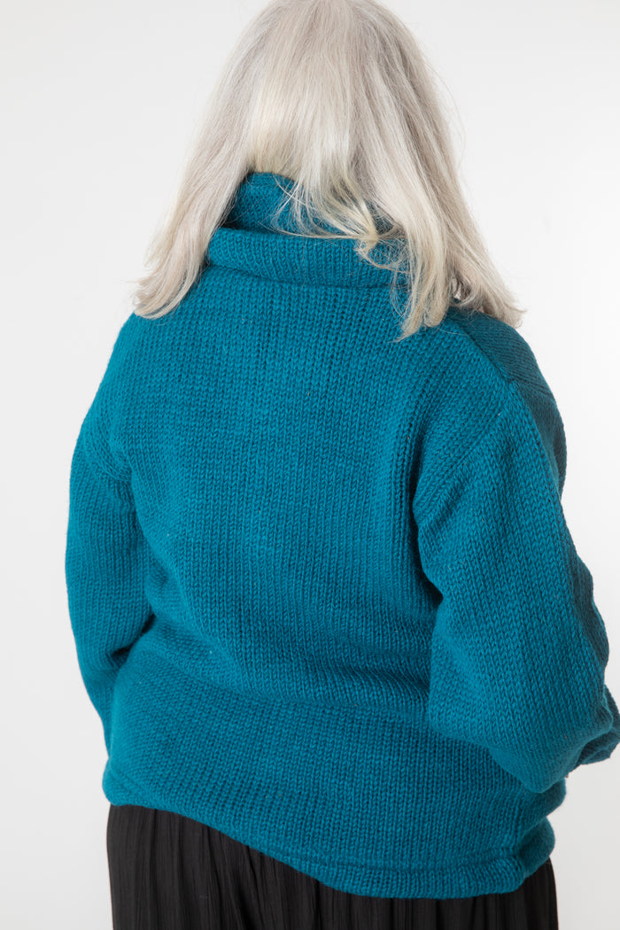 Toni wearing size S Teal wool hoodie jacket