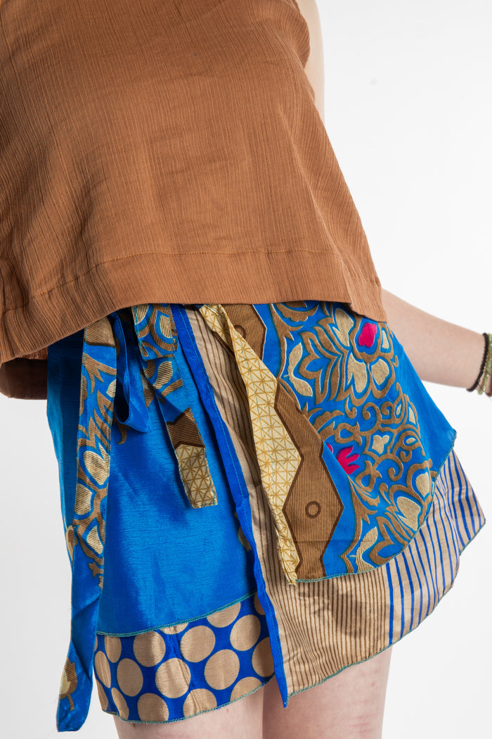 Honora is wearing a silk wrap skirt in Morning Dew