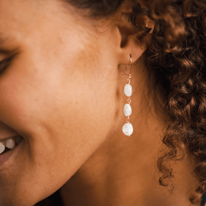 Moonstone Waterfall Earrings, worn in profile, gold