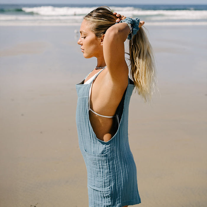 New Moon Blue Boardwalk Romper, open back on the beach