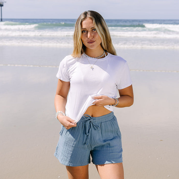 New Moon Blue Cabana Shorts, worn on the beach