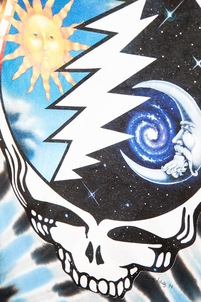 Grateful Dead Steal Your Face skull with lightning bolt, sun, and galaxy design on a tie-dye background