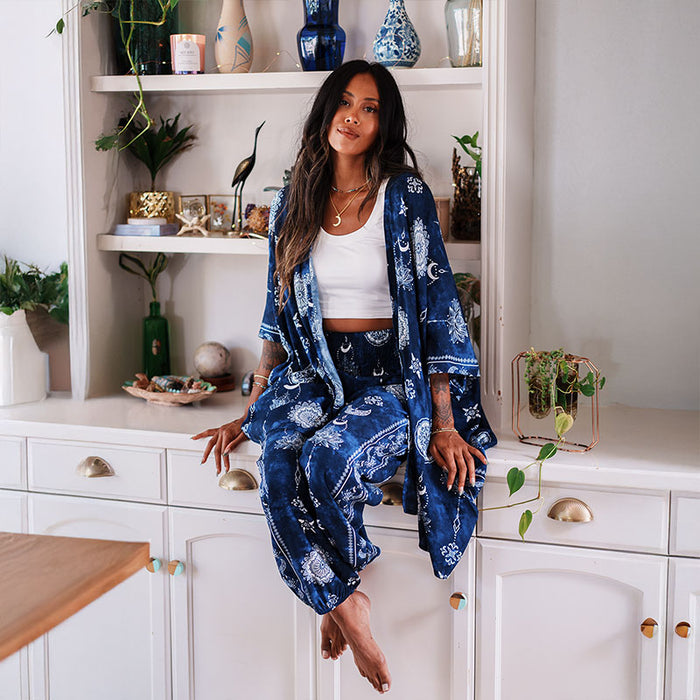 Nightfall Blue Lotus Moon Lounge Set, worn seated on a cabinet