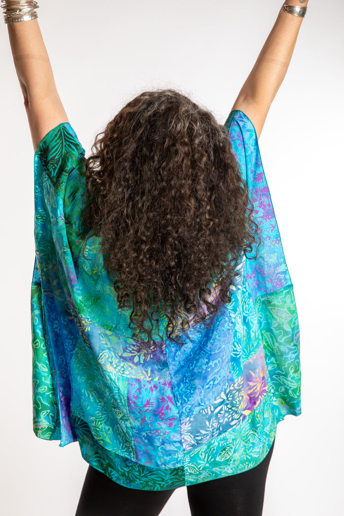 Susan is wearing the S/M Blue patchwork batik top in Turquoise