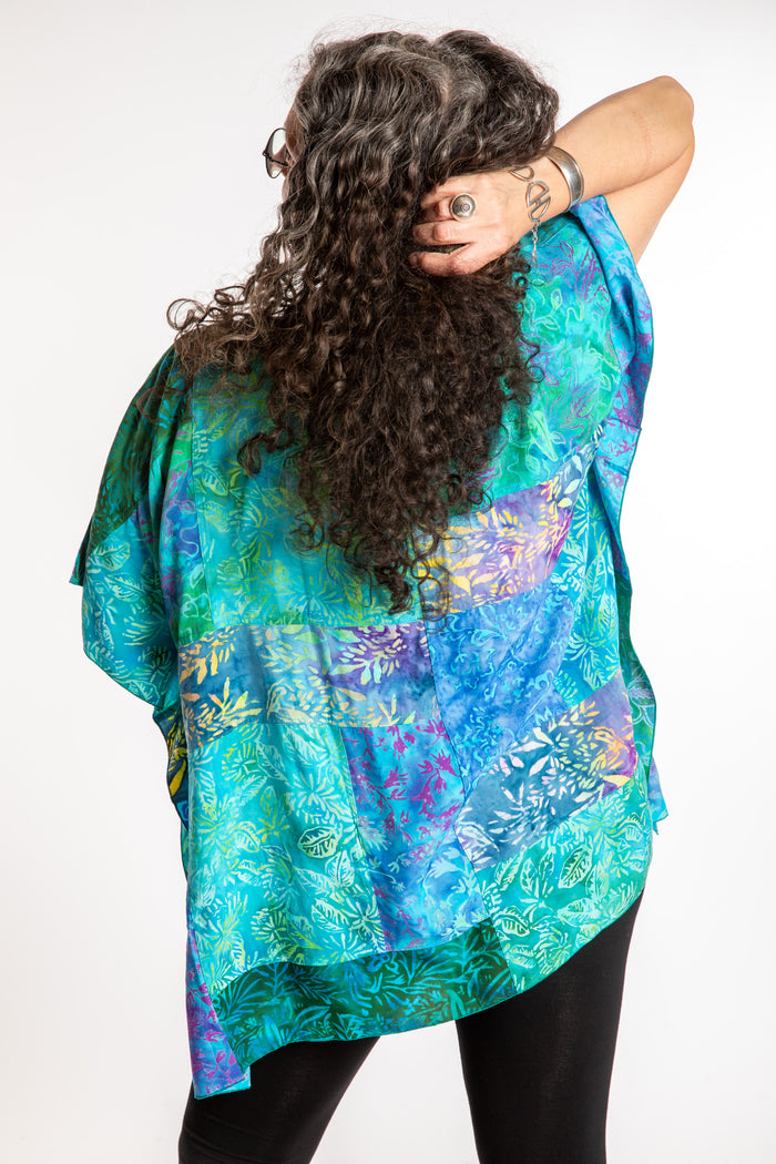 Susan is wearing the S/M Blue patchwork batik top in Turquoise
