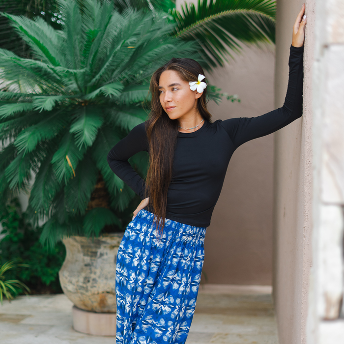 Onyx Hatha Long Sleeve Top, leaning on a wall