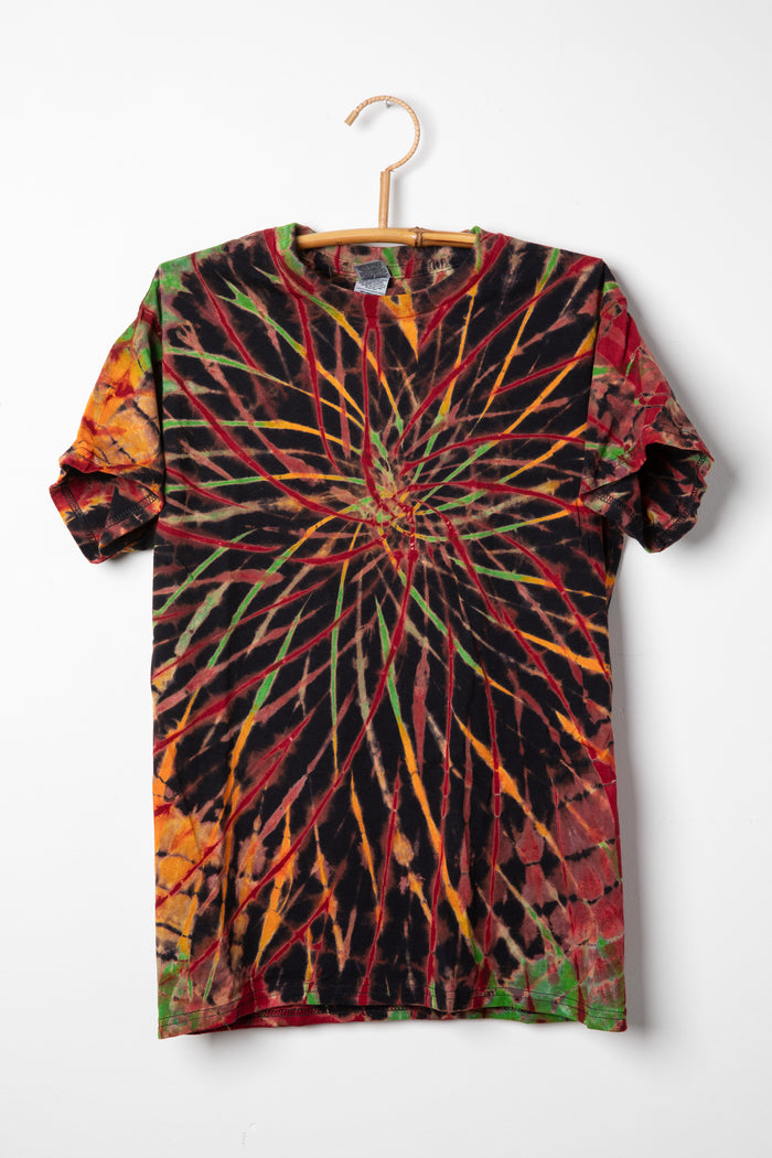 Tie-dye Rasta colored t-shirt with a spiral pattern on a white background