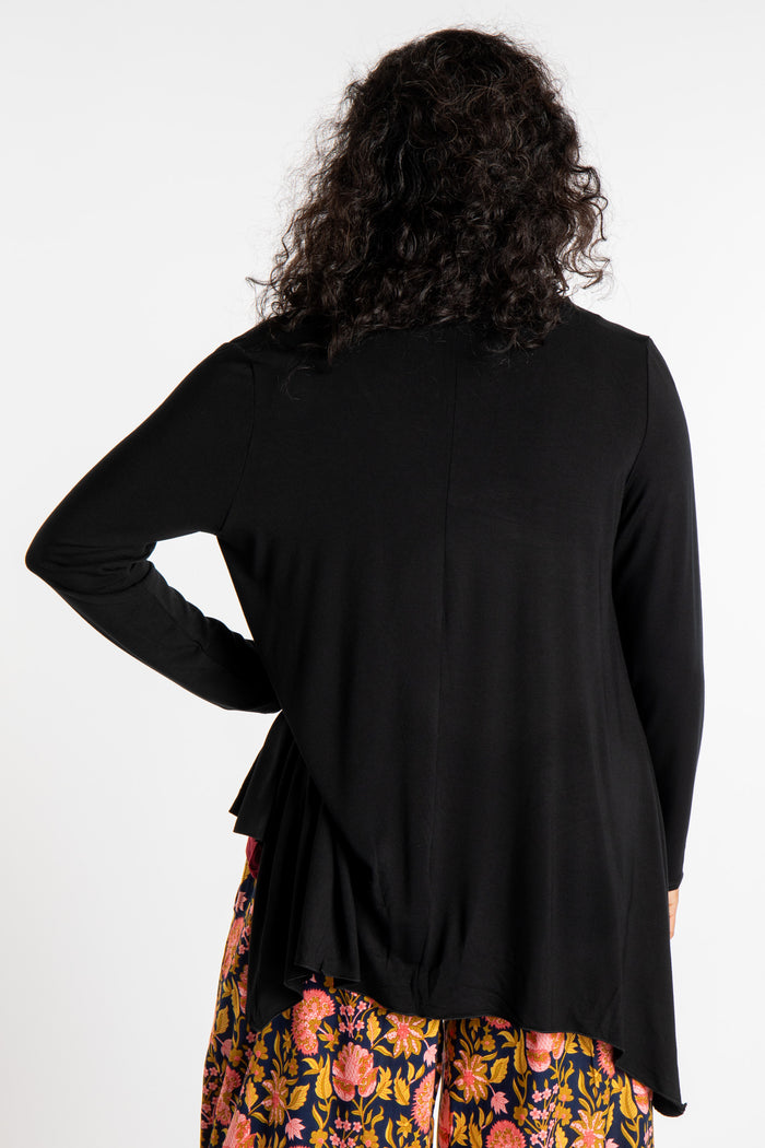 Teciane is wearing the Solid Color Cover-Up is Black