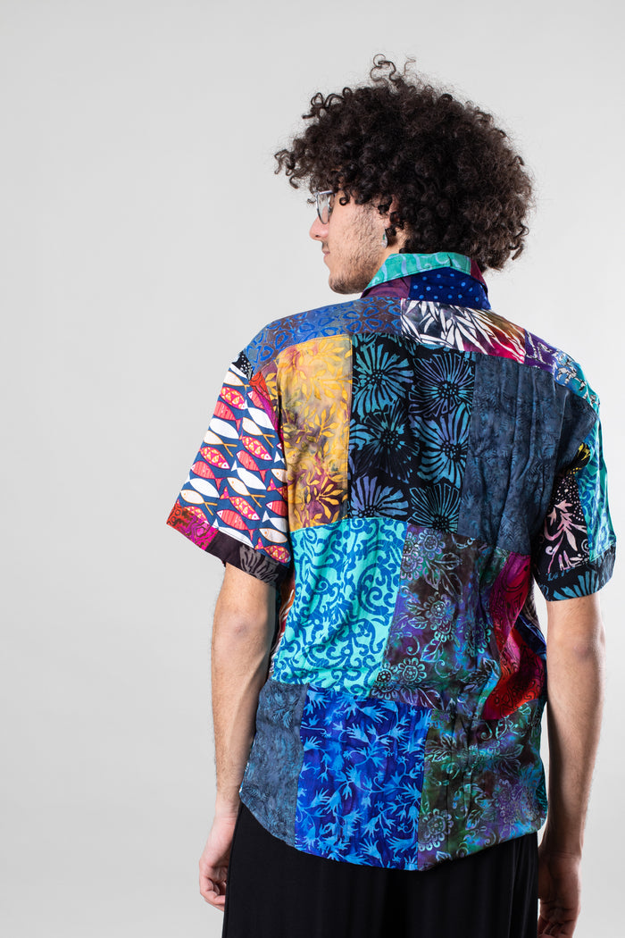 Marc is wearing size L patchwork button up shirt in multicolor