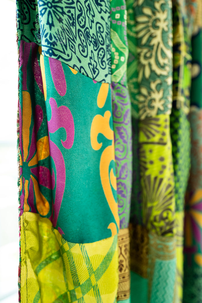 Close-up of colorful patchwork curtain fabric with various patterns