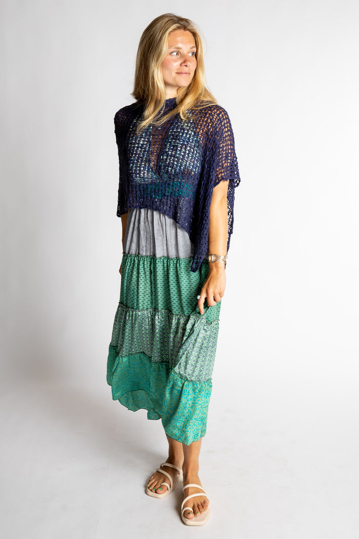 Sophie is wearing size S/M blue and green patchwork halter dress in morning dew