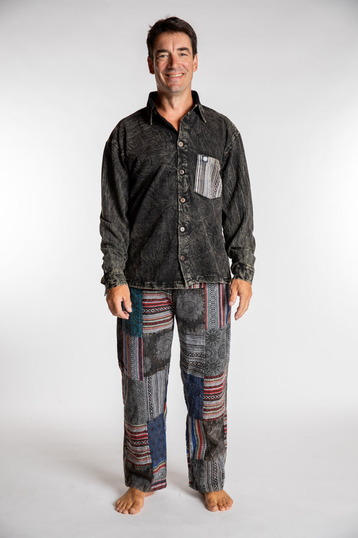 Topher is wearing the Black Patchwork Stone Wash Meditation Pants in XL