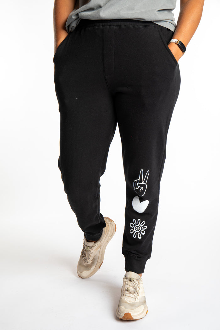 Sophie is wearing size S black Peace, Love, Mexicali jogger sweatpants