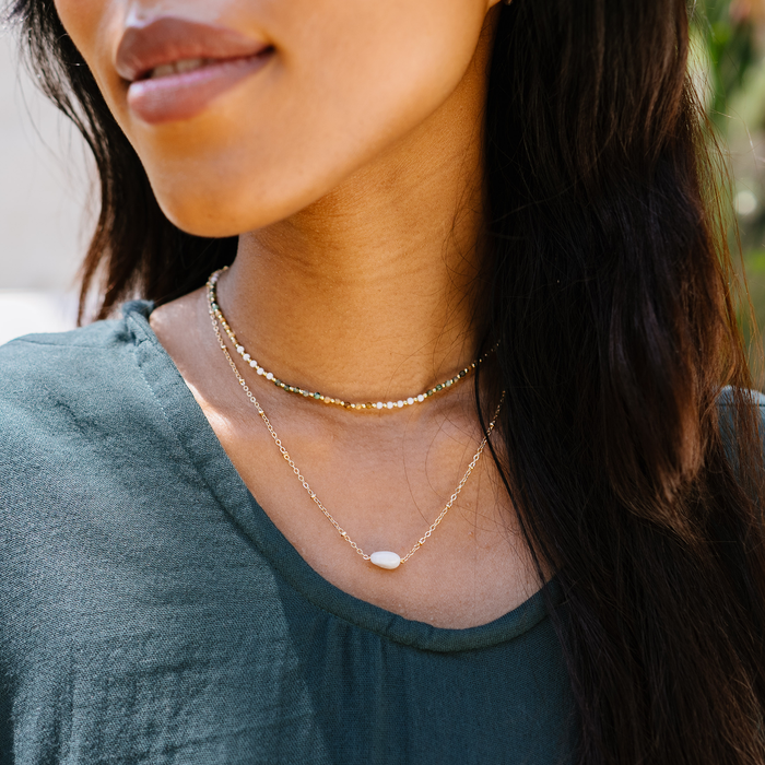 Peace Protector 2mm Healing Necklace, layered on the neck