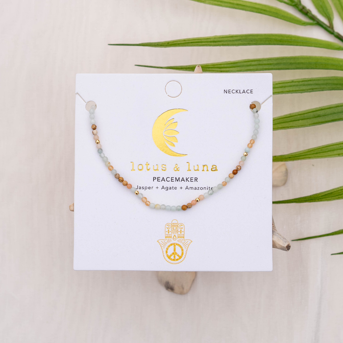 Peacemaker 2mm Healing Necklace, flat lay on card