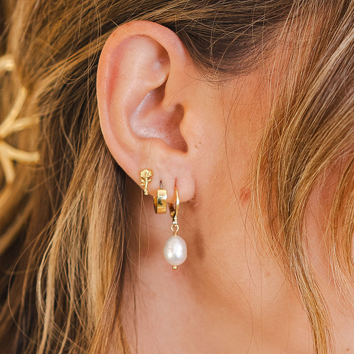 Pearl Drop Earrings, worn on ear close-up