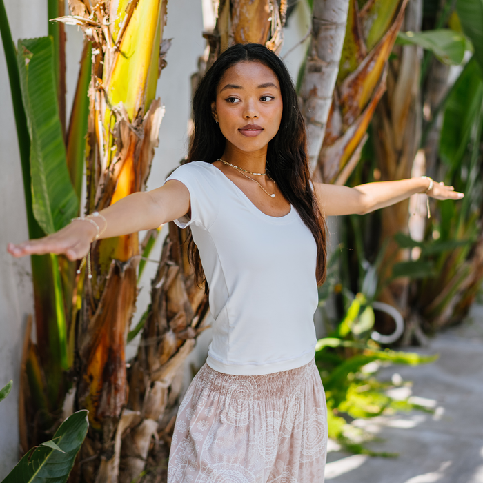 Pearl Full Length Yin Scoop Neck Top, worn with arms outstretched