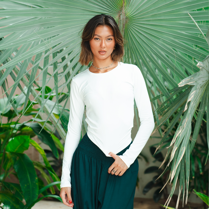 Pearl Hatha Long Sleeve Top, worn among palms