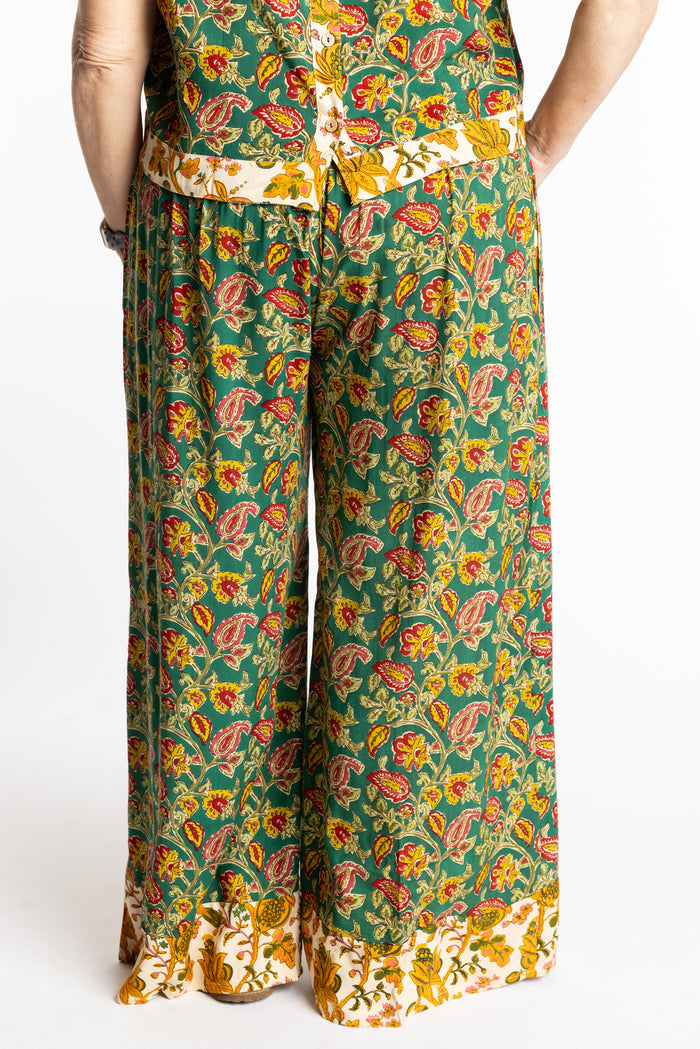 Betty wearing size M/L Forest Green floral Penny Lane contrast hem wide leg pants