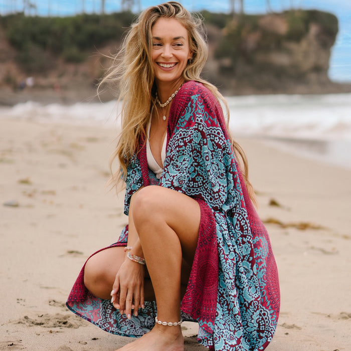 Poipu Kimono, worn crouched on the beach