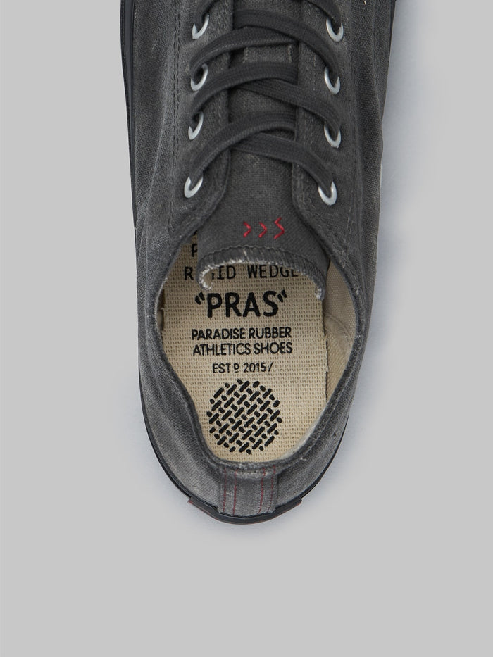 pras low shellcap sumi hand dyed black sneakers insole