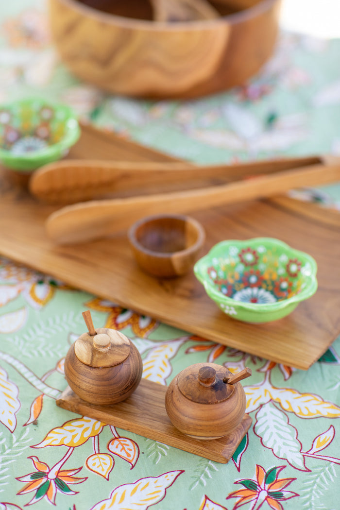 wood teak dining decor on a block print tablecloth