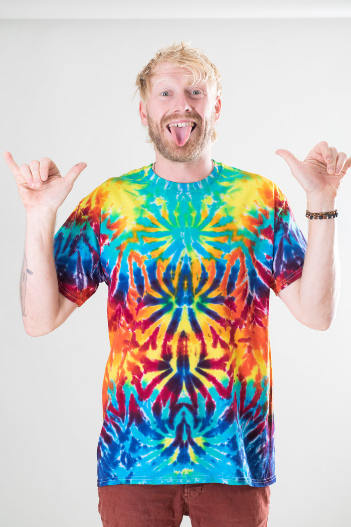 Chauncey is wearing size L rainbow crackle tie dye t shirt