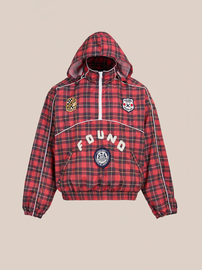 The FOUND Red Plaid Track Jacket features a red and black plaid design, white piping, embroidered patches, and "FOUND" across the front for a vintage sporty look.