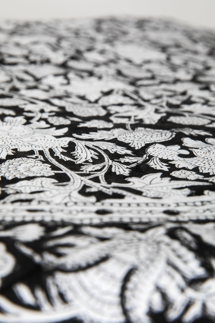 Round block print tablecloth in monochrome grove