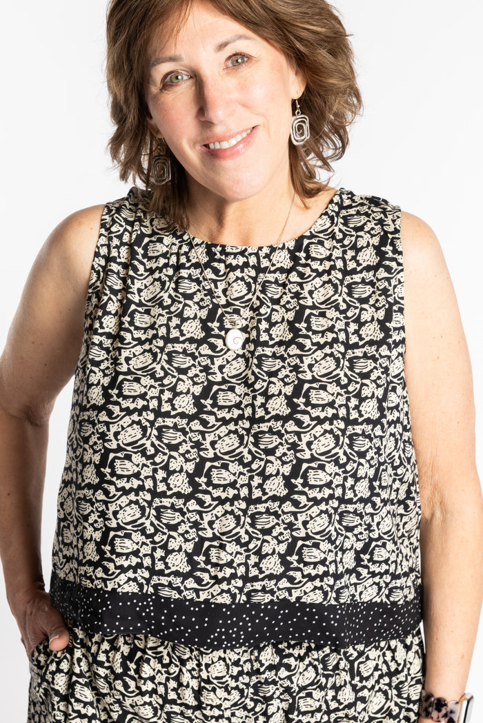 Betty wearing size L/XL Sahana Contrast Hem Sleeveless Top in Black Primrose floral print flowy boho sleeveless top