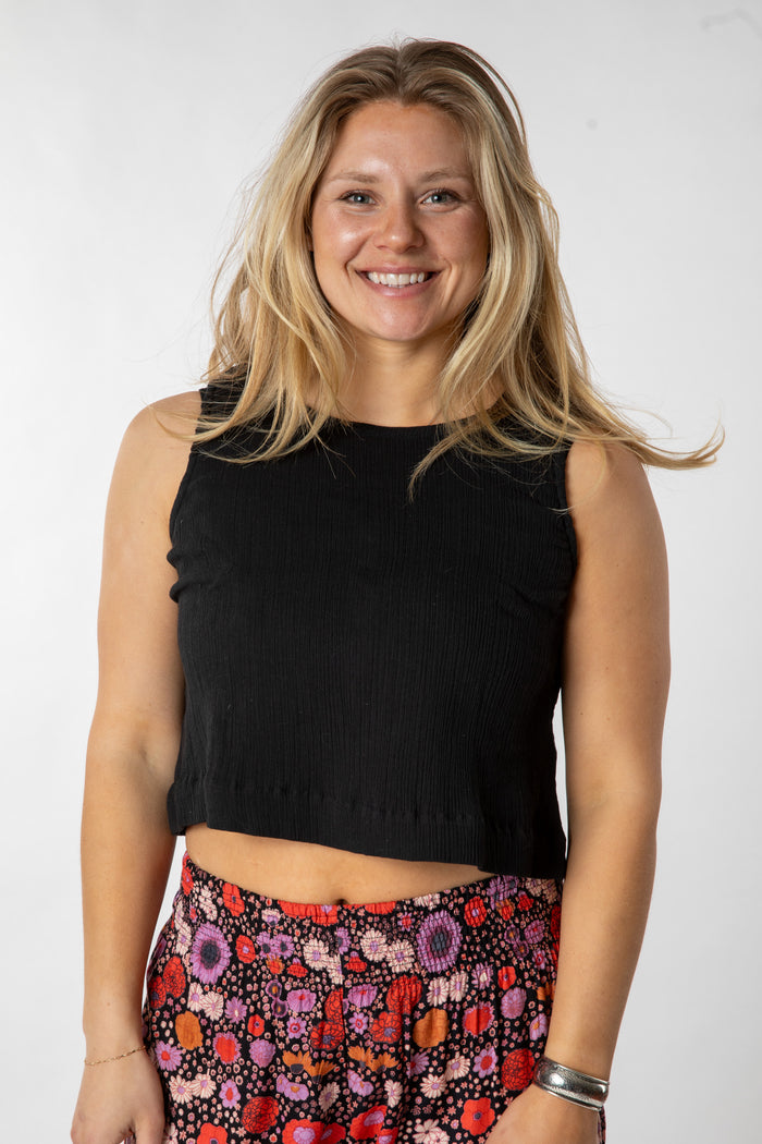Sophie is wearing size S cotton tank top in black