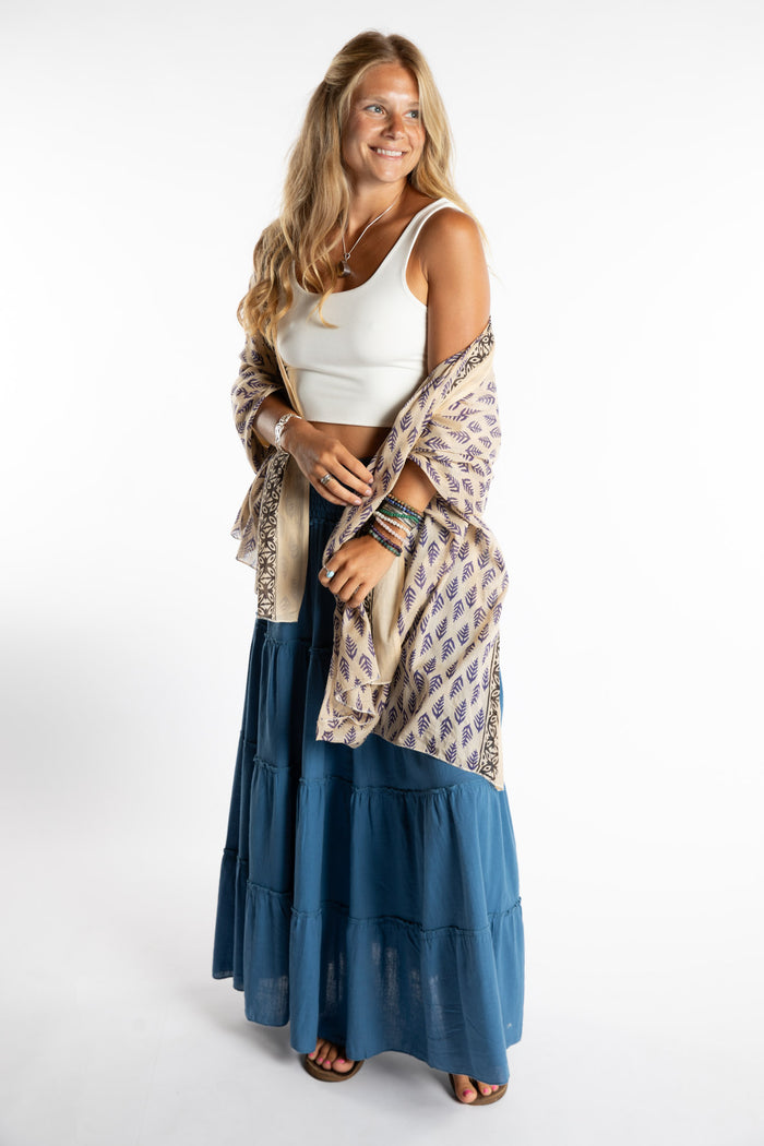Sophie is wearing the Kala Cotton Sarong in Blue and White