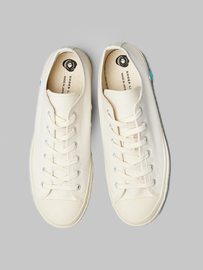 Shoes like pottery low white sneakers up view