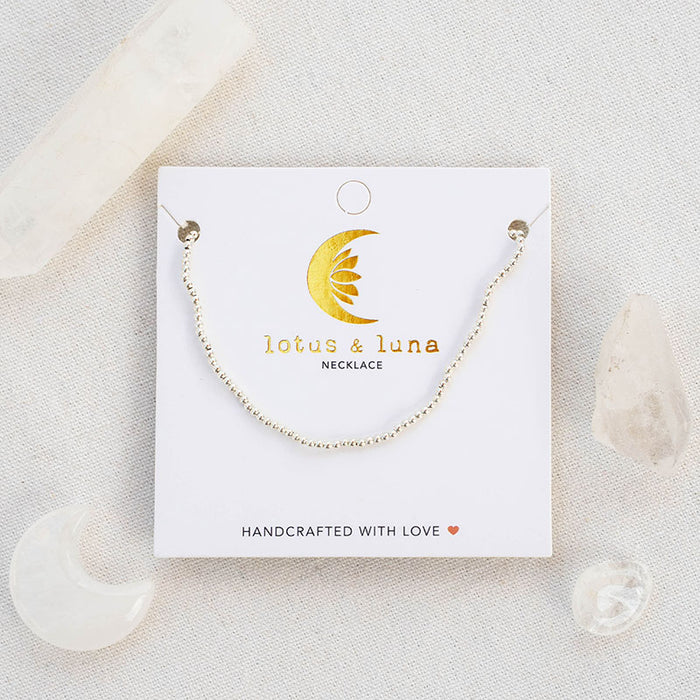 Silver 2mm Bead Necklace, flat lay on card
