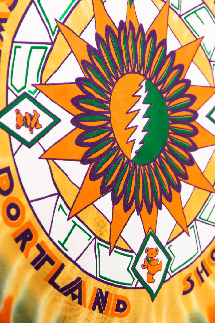 Colorful tie-dye pattern with a prominent green leaf design and 'Portland' text.