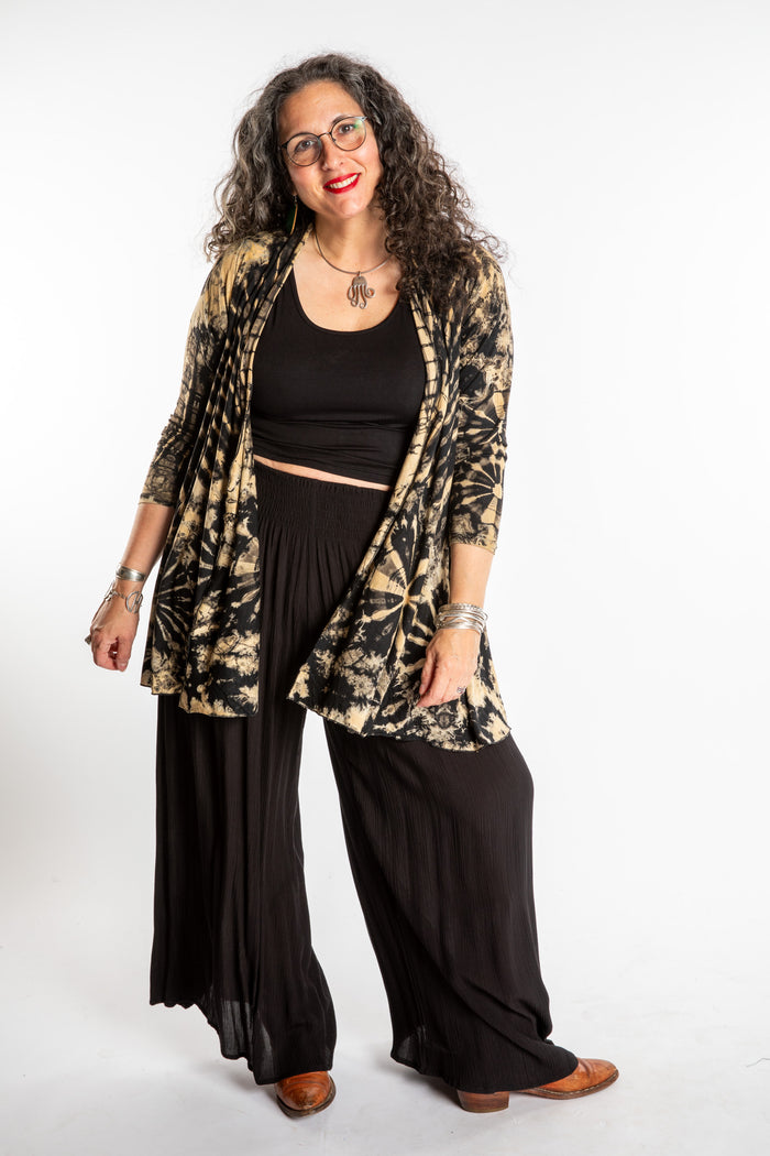 Susan wearing a black and white mudmee tie dye cardigan