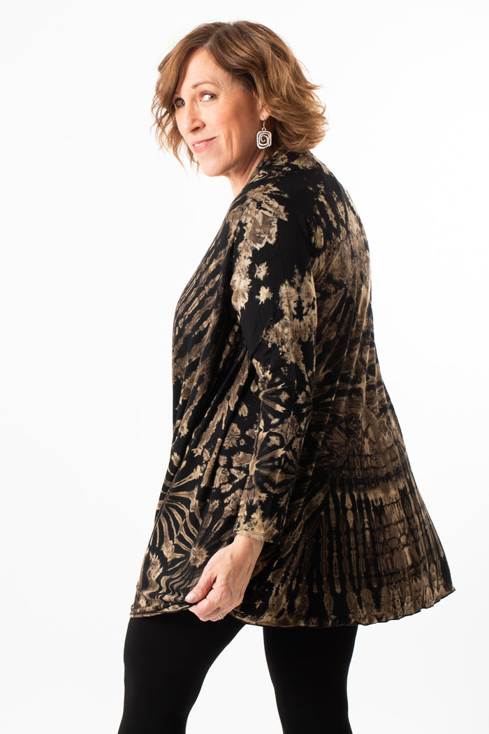 Betty wearing a black and white mudmee tie dye cardigan