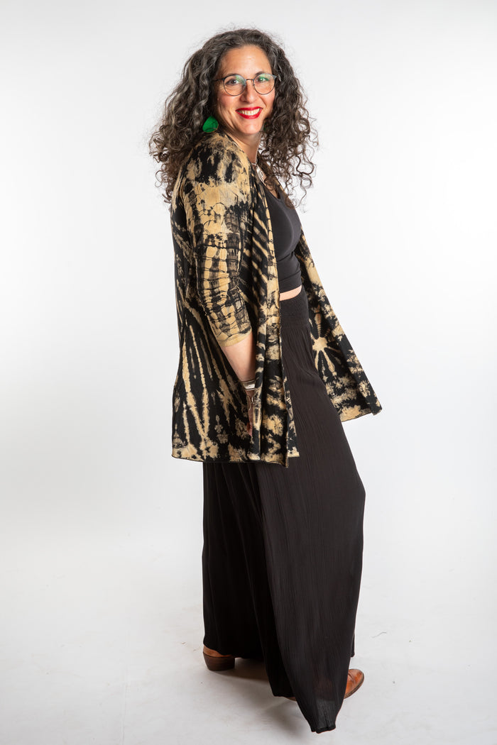 Susan wearing a black and white mudmee tie dye cardigan