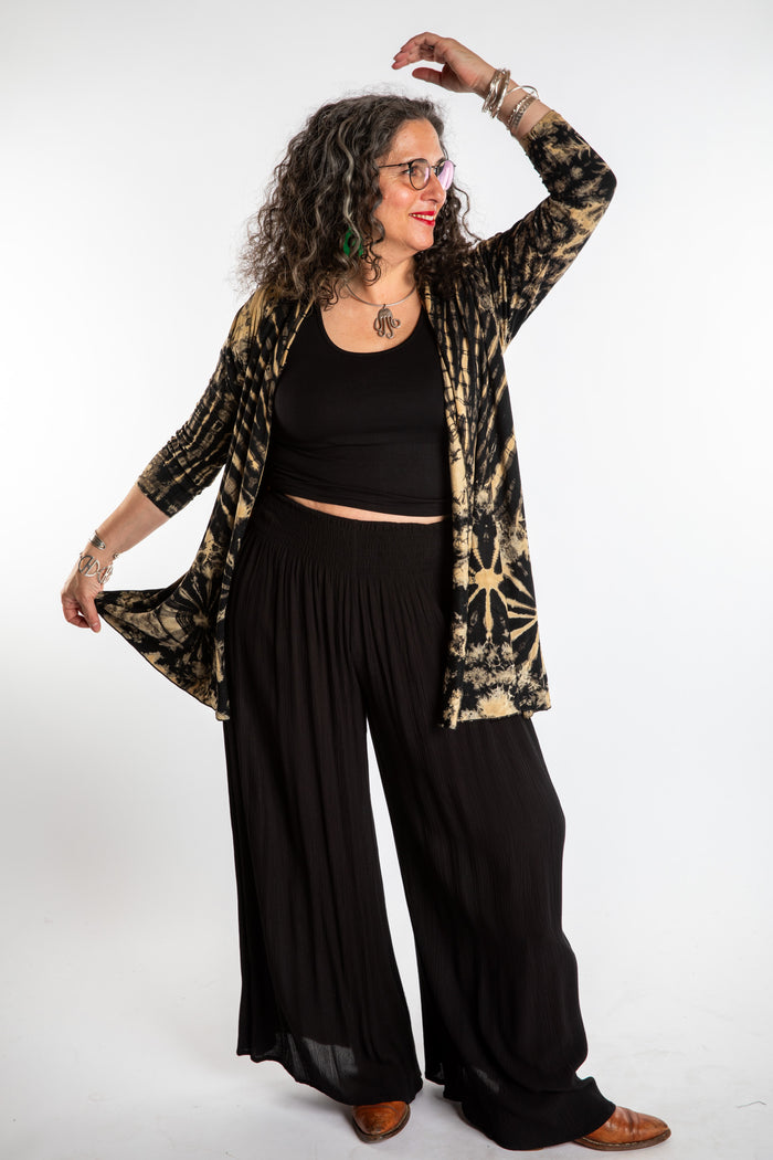 Susan wearing a black and white mudmee tie dye cardigan