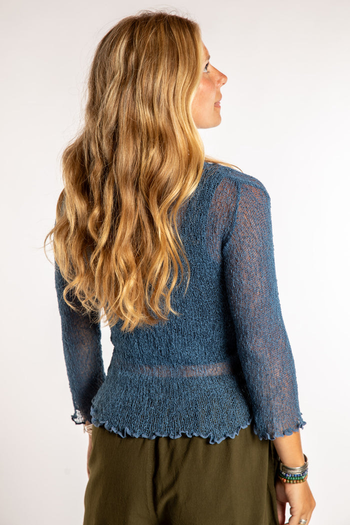 Sophie is wear the Summer Shrug Cardigan in Blue