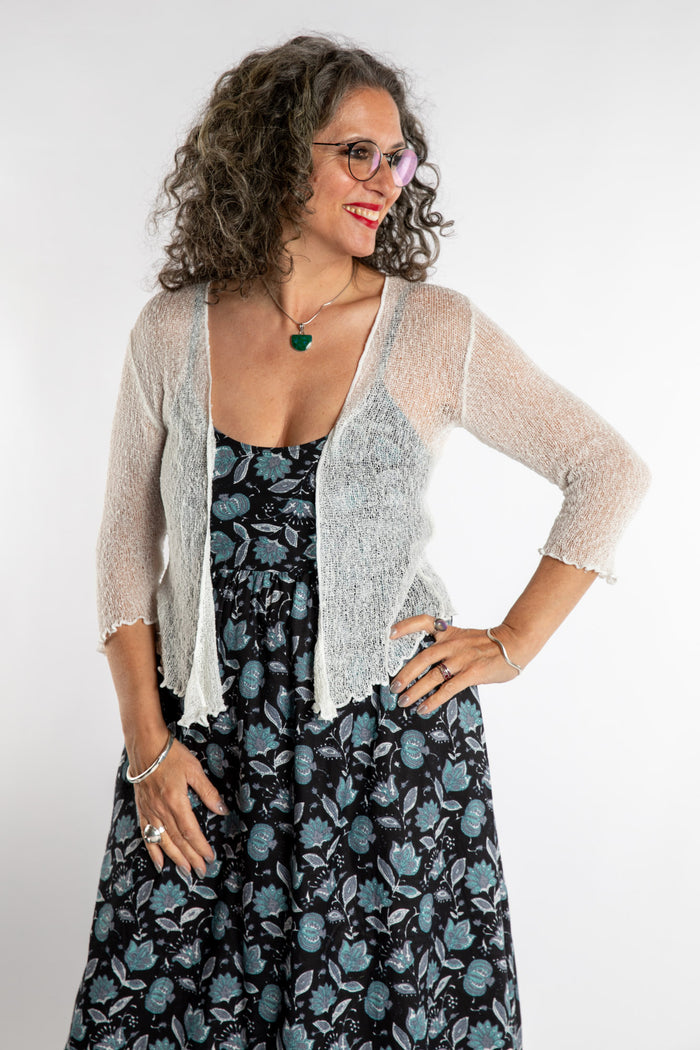 Susan is wear the Summer Shrug Cardigan in White