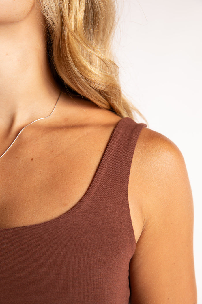 Sophie is wearing size S/M tank top in Brown