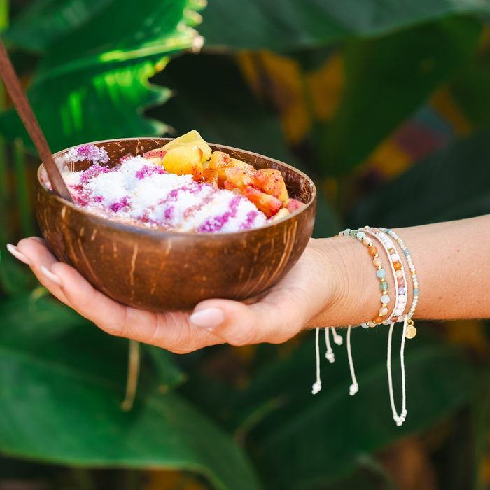 Sunrise Shack Healing Bracelet, worn holding smoothie bowl