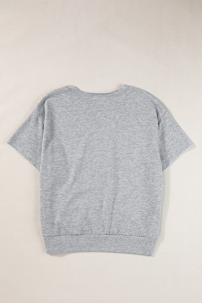 T-shirt ample gris clair avec lettrage USA et col cranté