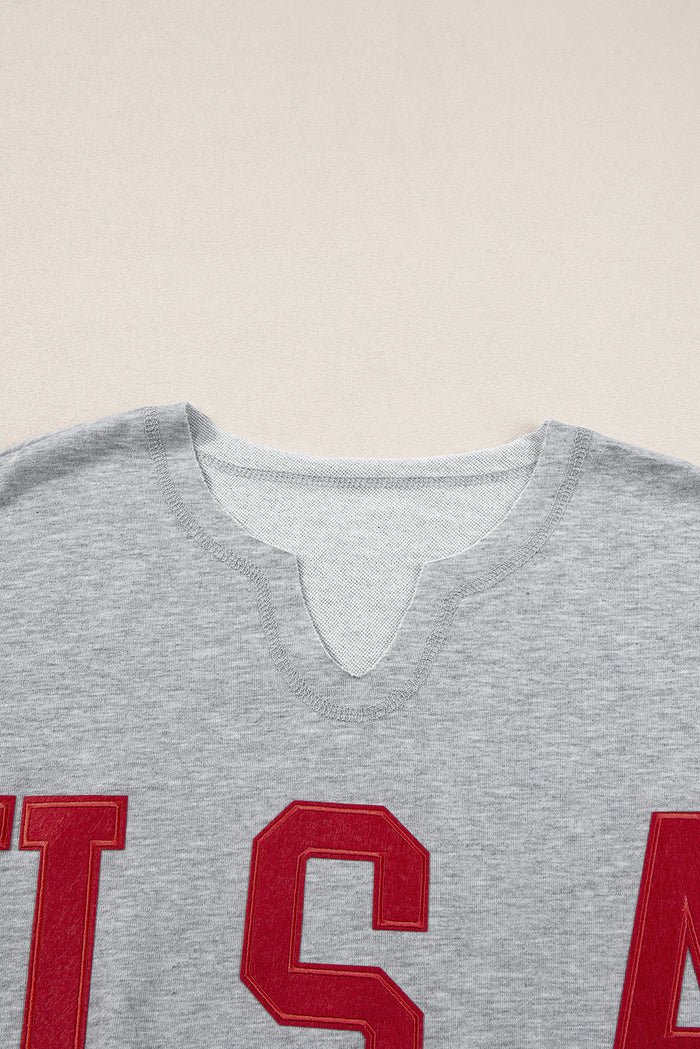 T-shirt ample gris clair avec lettrage USA et col cranté