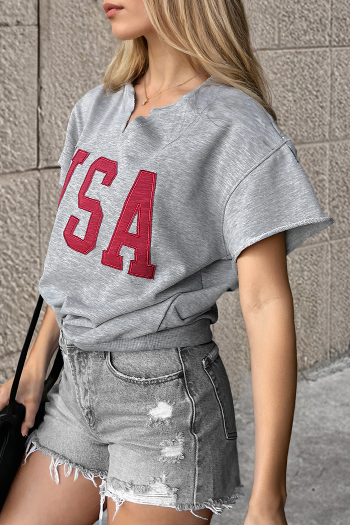 T-shirt ample gris clair avec lettrage USA et col cranté